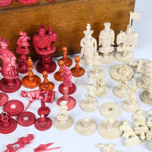 315 - A collection of 19th century red and white stained ivory chessmen