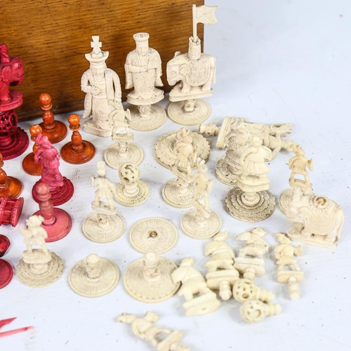 315 - A collection of 19th century red and white stained ivory chessmen