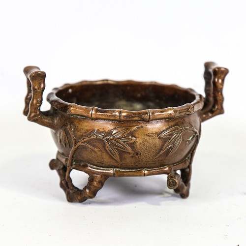 164 - A Chinese patinated bronze 2-handled incense burner, relief moulded bamboo designs, impressed 6 char... 