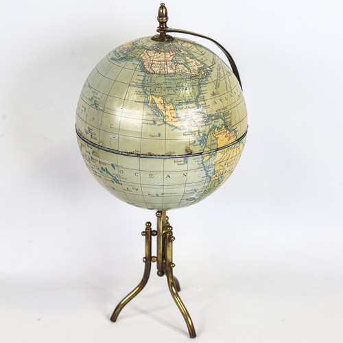 192 - A tinplate and brass desk globe, height 36cm, diameter approx 16cm