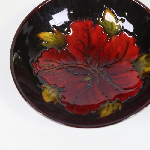 352 - MOORCROFT POTTERY - Hibiscus pattern bowl, diameter 14cm, original label under base