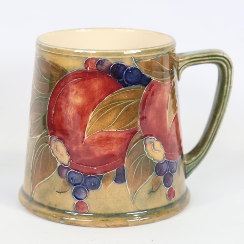 354 - MOORCROFT - Pomegranate and Grape pattern pint mug, made for Liberty & Co, registered no. 452777, he... 