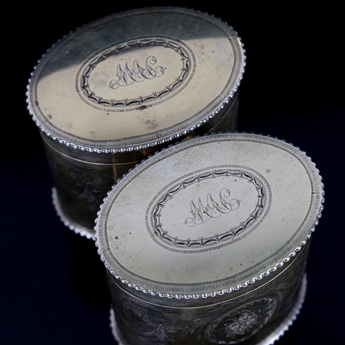 360 - A pair of 19th century electroplate oval tea caddies, with engraved decoration, height 9cm