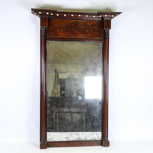 249 - A mahogany, Regency silver backed mirror with column supports, height 93cm