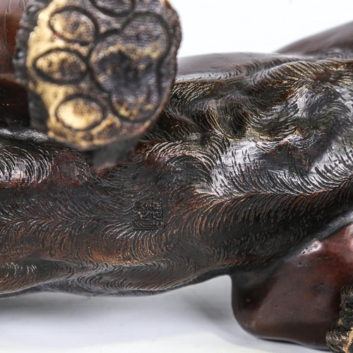 250 - An Meiji period, Japanese, patinated bronze tiger, with makers stamp to underside, length 65cm