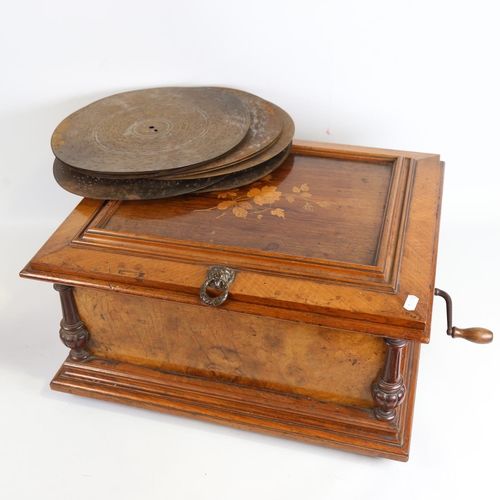 101 - A 19th century table symphonion, floral marquetry inlaid case with brass mounts, transfer printed pa... 