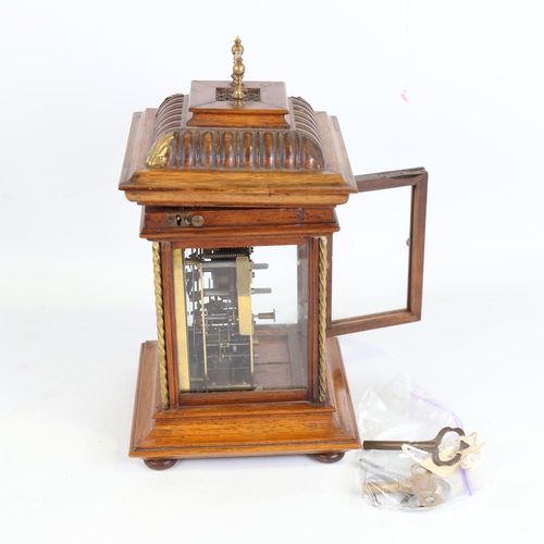 102 - A 19th century German walnut-cased symphonion table clock, carved and brass-mounted case, the top op... 