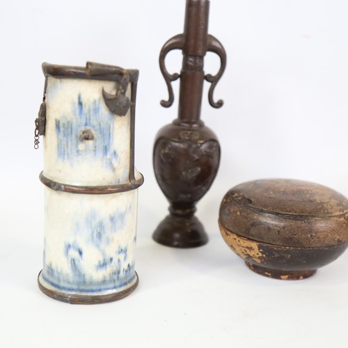 67 - A group of Oriental items, including a bronze narrow-neck vase, height 21cm, and a blue and white po... 