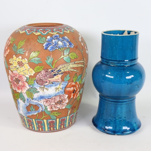 72 - A Chinese terracotta vase, with painted enamel birds and flowers, height 28cm, and a blue glaze porc... 