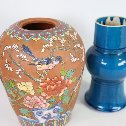 72 - A Chinese terracotta vase, with painted enamel birds and flowers, height 28cm, and a blue glaze porc... 