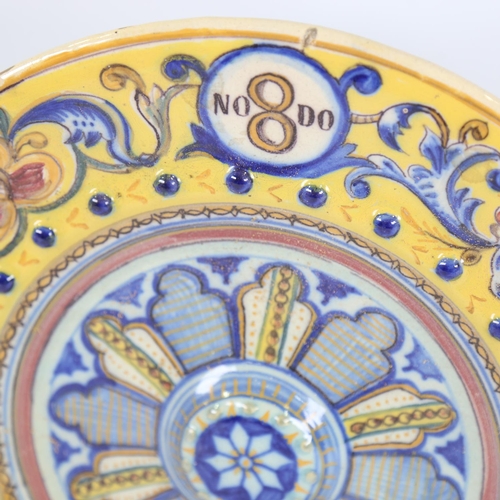 74 - 19th century French/Italian faience pottery charger, raised central boss with raised beaded surround... 