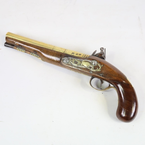 78 - A George II brass-barrelled flintlock coaching pistol, barrel stamped Rimes London, engraved brass t... 