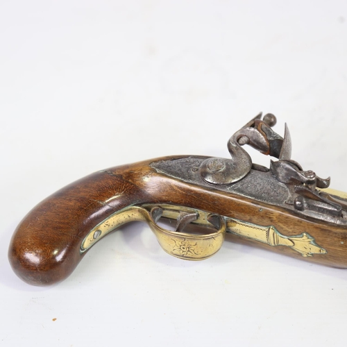 78 - A George II brass-barrelled flintlock coaching pistol, barrel stamped Rimes London, engraved brass t... 