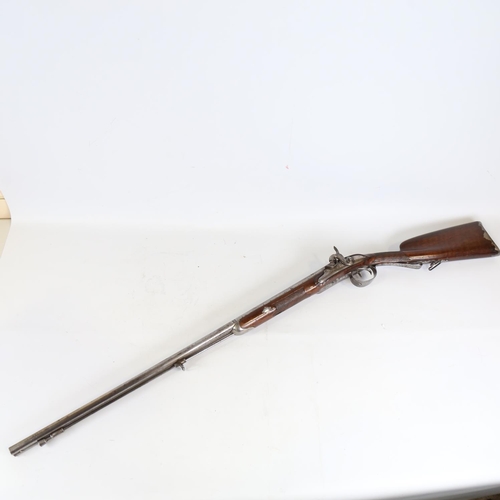 80 - An early 19th century double-barrelled percussion sporting gun, circa 1800, signed Bouillet, carved ... 