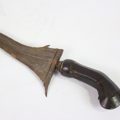 82 - A Malayan Kris knife, with carved horn handle and white metal scabbard, overall length 52cm