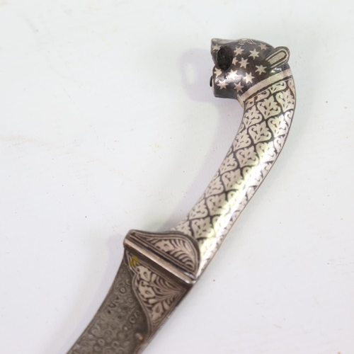 83 - An ornate Middle Eastern white metal inlaid knife, with leopard-head handle, length 30cm