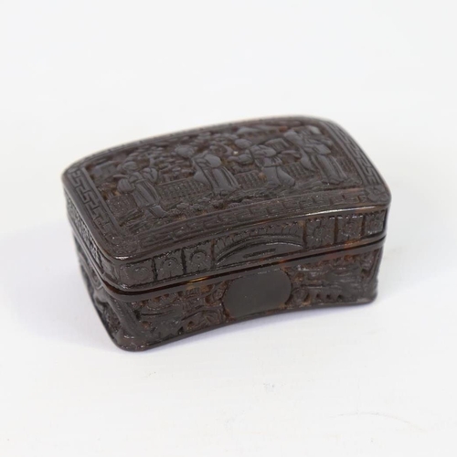 27 - A 19th century Chinese tortoiseshell snuffbox of curved rectangular form, relief carved allover with... 