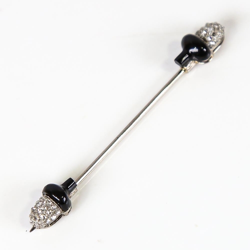 575 - A French Art Deco onyx and diamond acorn jabot pin, unmarked white metal settings with rose-cut diam... 