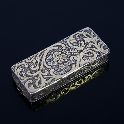 582 - A 19th century unmarked silver combination snuffbox/Vesta case, rectangular form with raised gilded ... 