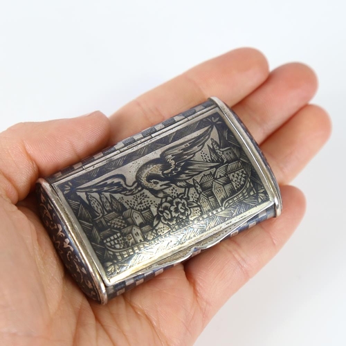 584 - A Russian silver and niello snuffbox, cushion form with eagle cityscape and floral decoration, 6.5cm... 