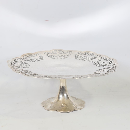 585 - A George V silver pedestal cake stand, pierced Adams style and foliate decoration, by Charles S Gree... 