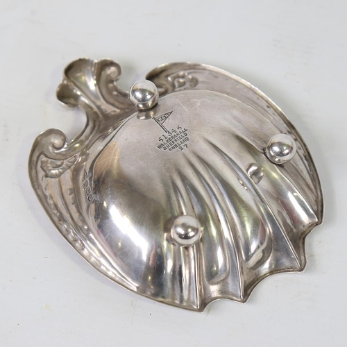 589 - A George V Art Nouveau silver shell sweetmeat dish, relief embossed decoration, by Walker & Hall, ha... 