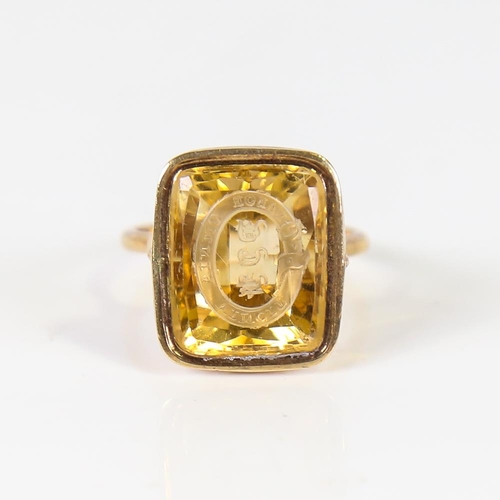 596 - A large Antique 9ct gold citrine seal ring, with garter motto 