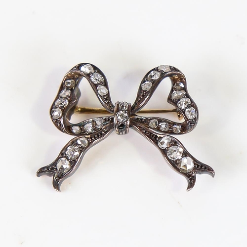 602 - A late 19th century diamond bow brooch, unmarked gold and silver settings with rose and old-cut diam... 