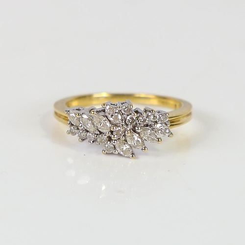 603 - A modern 18ct gold diamond cluster dress ring, set with marquise and round brilliant-cut diamonds, t... 