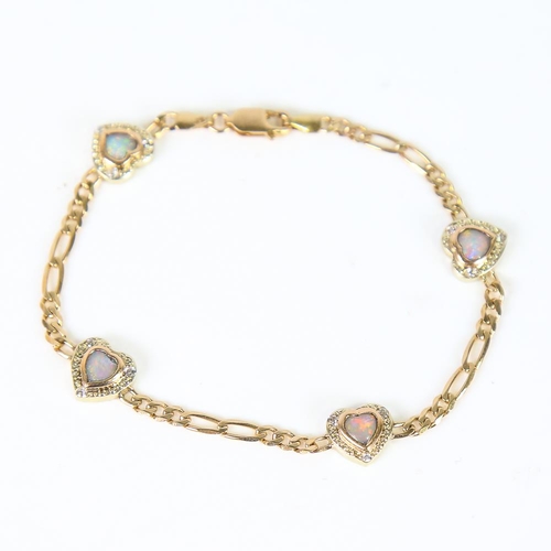 604 - A modern 9ct gold opal and cubic zirconia heart bracelet, each heart panel separated by figaro links... 