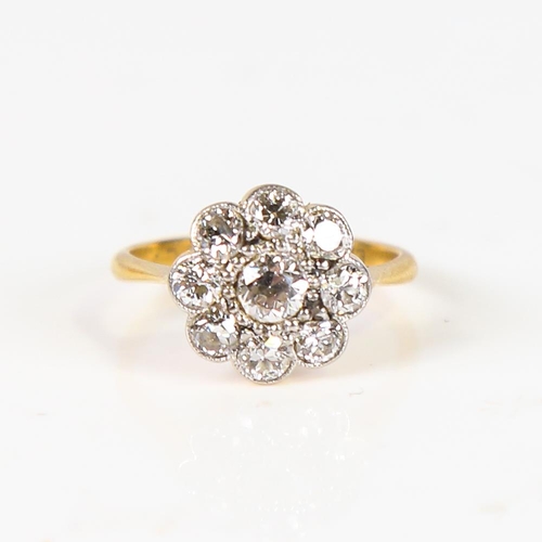 605 - An Antique 18ct gold diamond cluster flowerhead ring, set with old European-cut diamonds, total diam... 