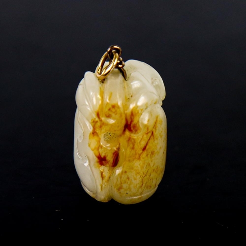 606 - A Chinese carved and polished jade peach fruit pendant, with unmarked yellow metal wirework bale, he... 