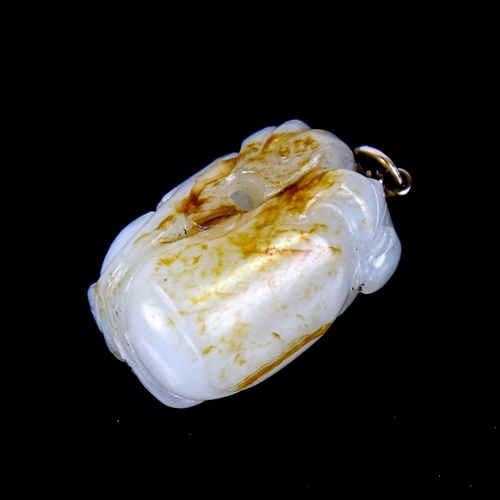 606 - A Chinese carved and polished jade peach fruit pendant, with unmarked yellow metal wirework bale, he... 