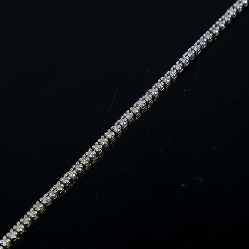 610 - A modern 9ct white gold diamond tennis line bracelet, set with eight-cut diamonds, total diamond con... 