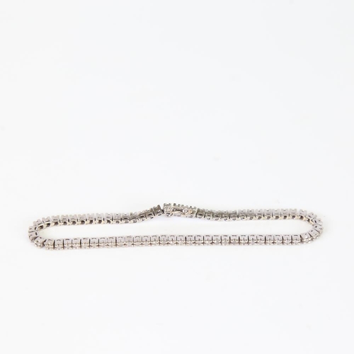 610 - A modern 9ct white gold diamond tennis line bracelet, set with eight-cut diamonds, total diamond con... 