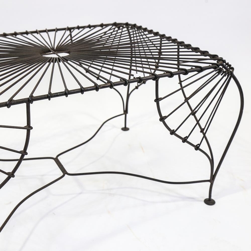 2097 - A 1980s wrought-wire frame table of organic form, height 47cm, length 78cm