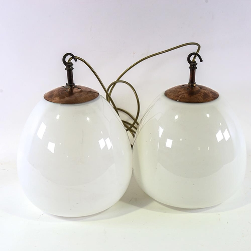 2110 - A pair of vintage globular ceiling lights with copper hanging fixtures, pendant height to hook 36cm