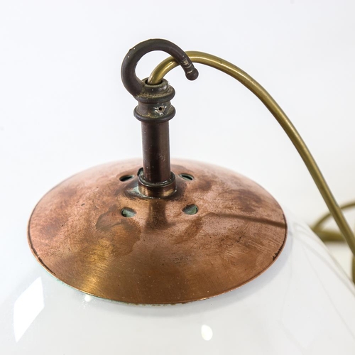 2110 - A pair of vintage globular ceiling lights with copper hanging fixtures, pendant height to hook 36cm