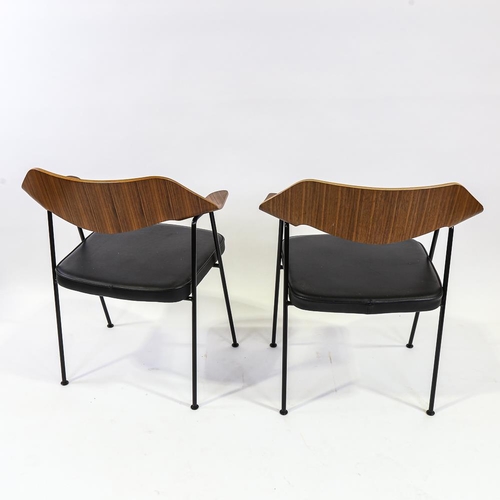 2112 - ROBIN DAY - a pair of 675 armchairs by Case Furniture, with maker's label to underside, height 79cm