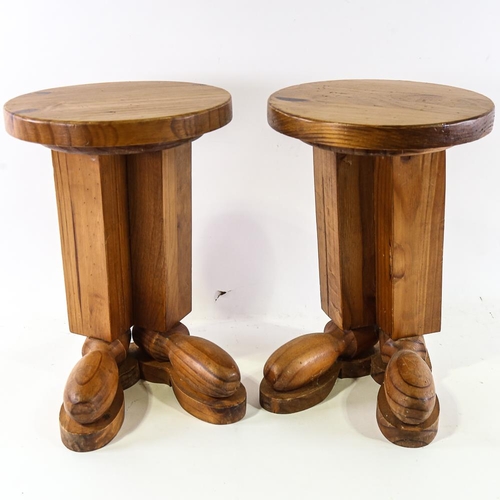 2117 - A pair of pine stools, the base of each styled as 2 boots, height 43cm