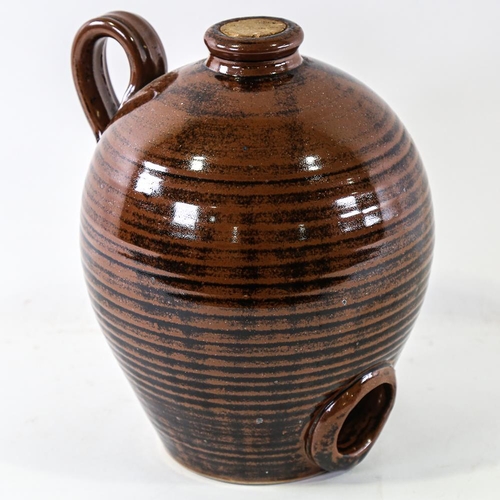 2121 - JONATHAN CHISWELL-JONES - Studio pottery flagon with Temoku glaze, height 27cm