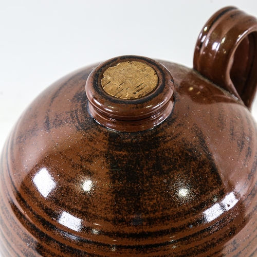 2121 - JONATHAN CHISWELL-JONES - Studio pottery flagon with Temoku glaze, height 27cm