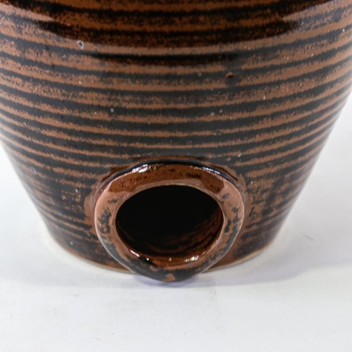 2121 - JONATHAN CHISWELL-JONES - Studio pottery flagon with Temoku glaze, height 27cm