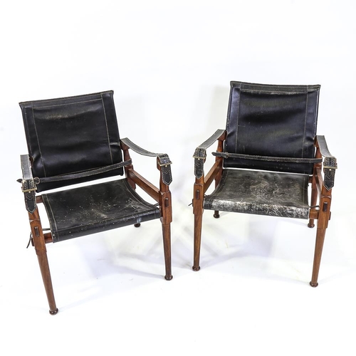 2142 - M HYAT & BROS LTD, a pair of hardwood and leather safari chairs, makers label on frame, height 78cm