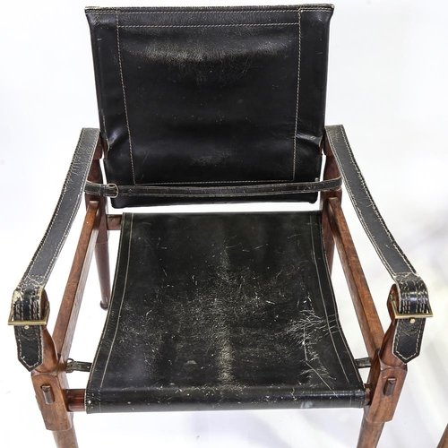 2142 - M HYAT & BROS LTD, a pair of hardwood and leather safari chairs, makers label on frame, height 78cm