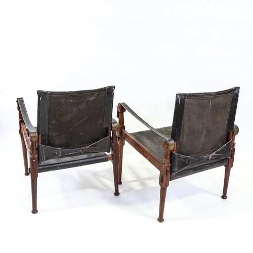 2142 - M HYAT & BROS LTD, a pair of hardwood and leather safari chairs, makers label on frame, height 78cm