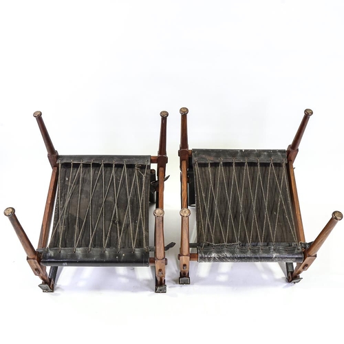 2142 - M HYAT & BROS LTD, a pair of hardwood and leather safari chairs, makers label on frame, height 78cm