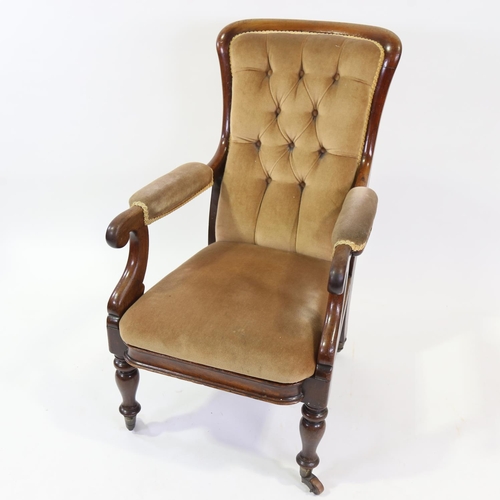 268 - A Victorian mahogany framed open arm fireside chair