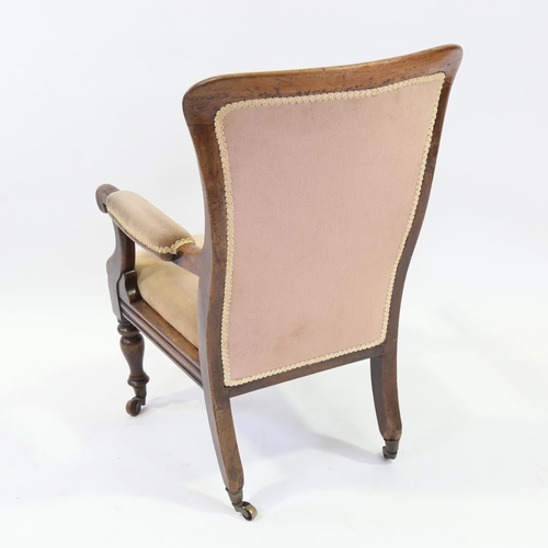 268 - A Victorian mahogany framed open arm fireside chair