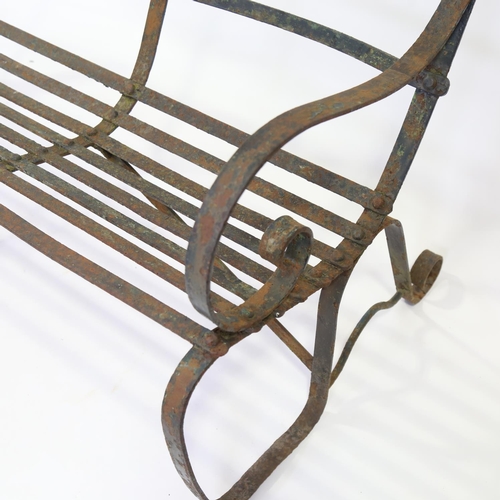 269 - A Victorian wrought-iron 3-seat garden bench with triple-curved back, length 150cm